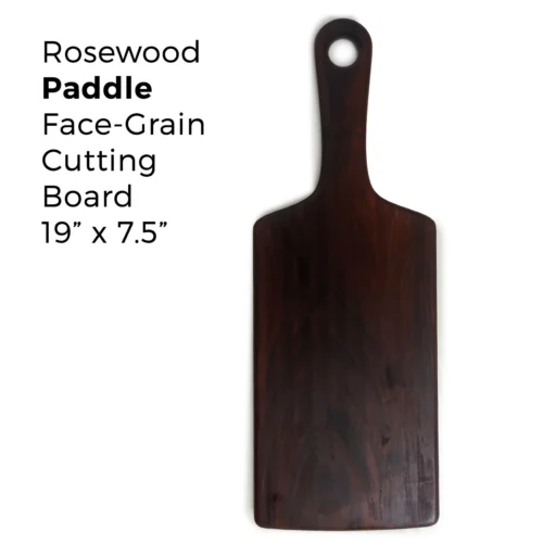 Front-facing view of rosewood paddle cutting board with centered handle and round hanging hole – 19x7.5 inches.
